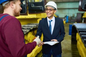 smiling-young-businessman-plant